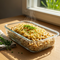 Vorarlberger Dinkel-Käsespätzle mit Bergkäse, glasierten Zwiebeln & Wiesenkräuter-Topping